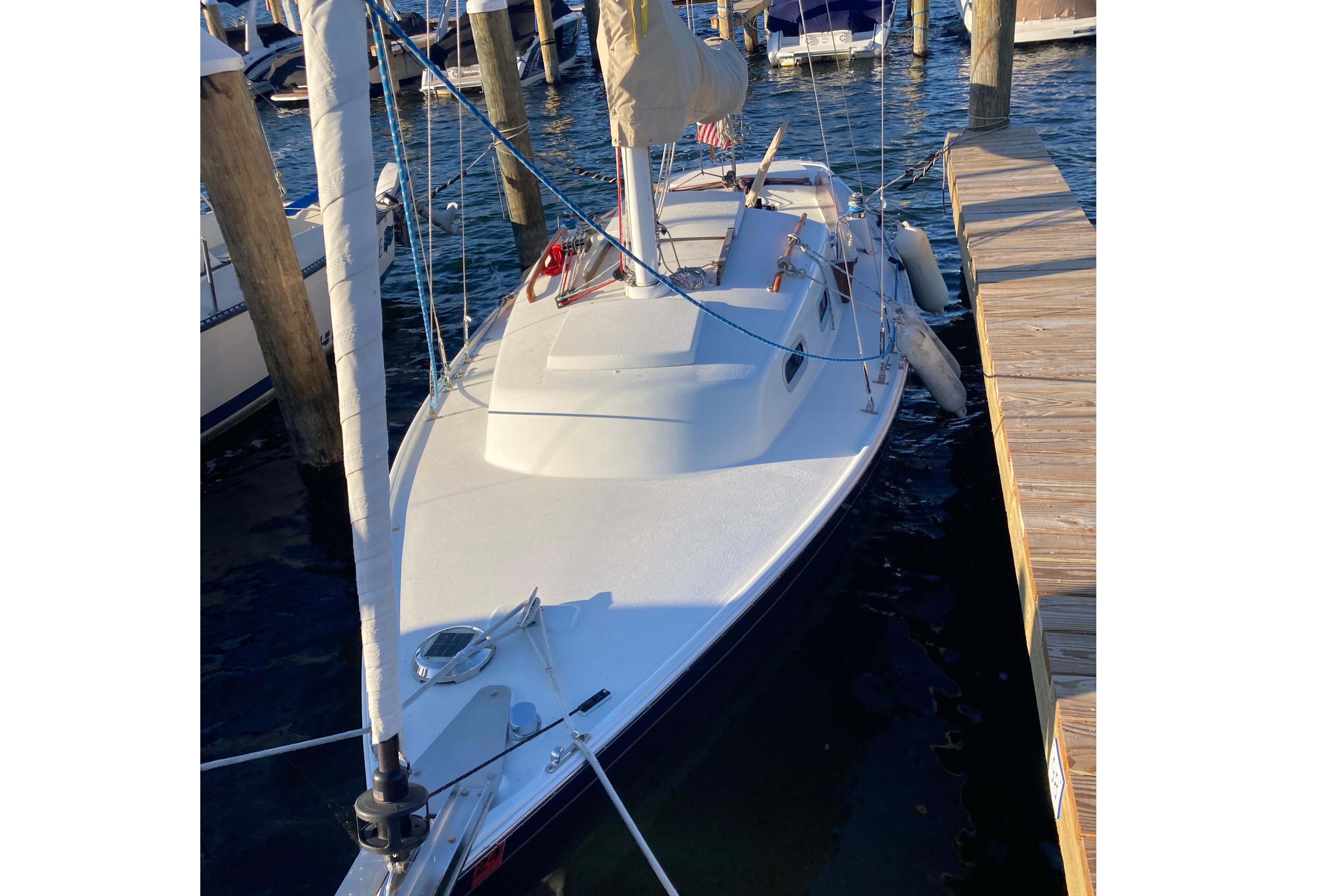 1964 Pearson Commander sailboat docked at marina, viewed from above.