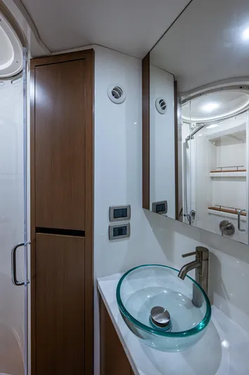  Yacht Photos Pics 2017 Sea Ray Sundancer 400 bathroom with modern glass sink and sleek wood cabinetry.