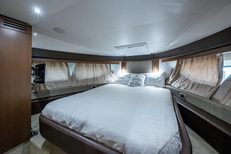  Yacht Photos Pics Luxurious bedroom interior of 2017 Sea Ray Sundancer 400 yacht with cozy bedding.