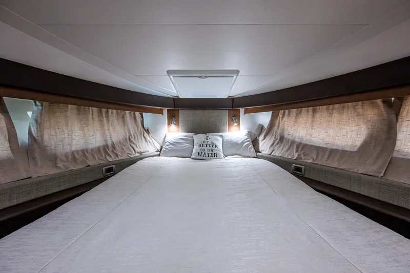  Yacht Photos Pics Luxurious bedroom interior of 2017 Sea Ray Sundancer 400 yacht with cozy bedding.
