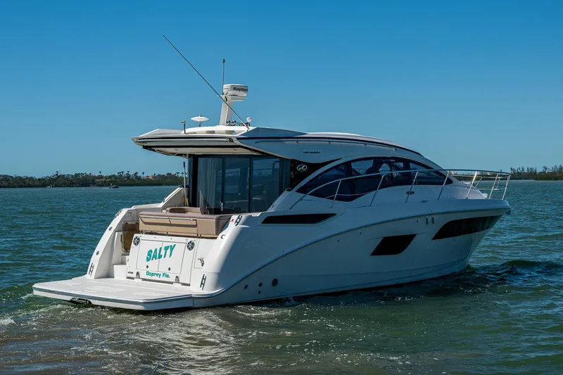  Yacht Photos Pics 2017 Sea Ray Sundancer 400 yacht cruising on open water under clear blue sky.