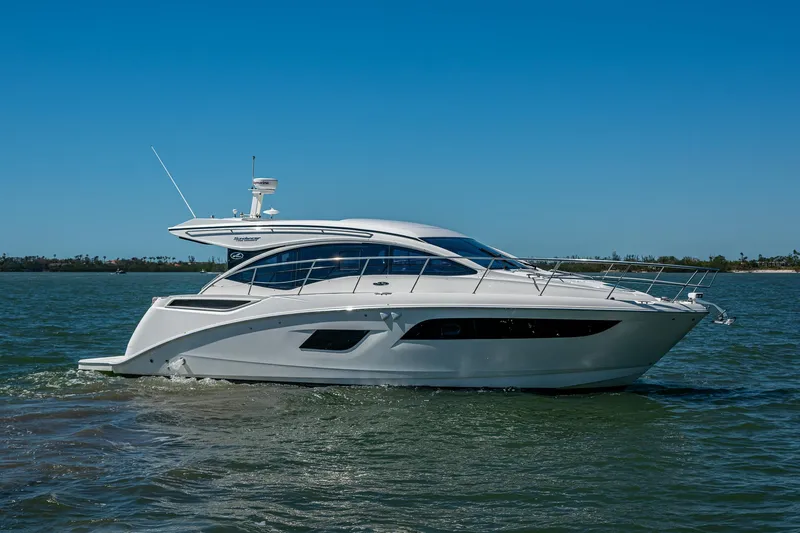  Yacht Photos Pics 2017 Sea Ray Sundancer 400 yacht cruising on open water under clear blue sky.