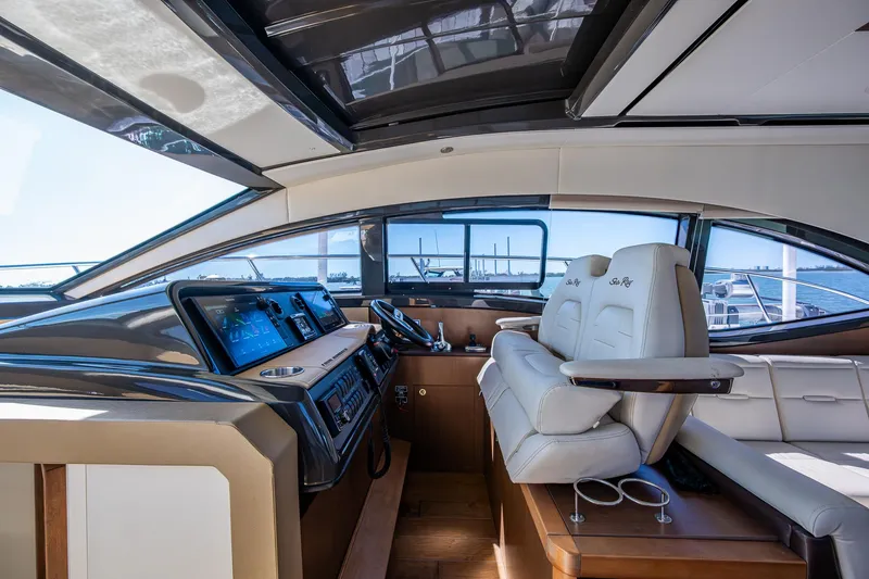  Yacht Photos Pics Interior of 2017 Sea Ray Sundancer 400 yacht with modern helm and seating.