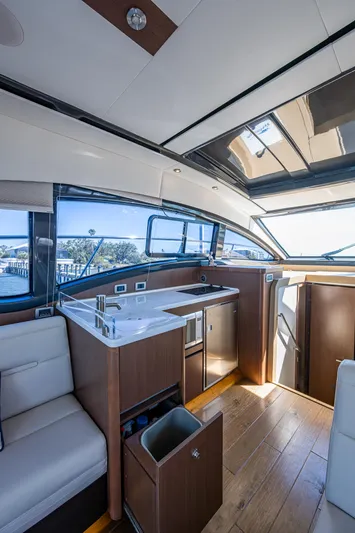  Yacht Photos Pics Interior of 2017 Sea Ray Sundancer 400 yacht with modern kitchen and seating area.