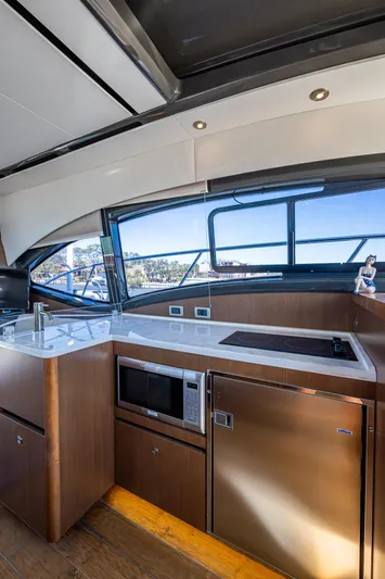  Yacht Photos Pics Interior of 2017 Sea Ray Sundancer 400 yacht with modern kitchen amenities.