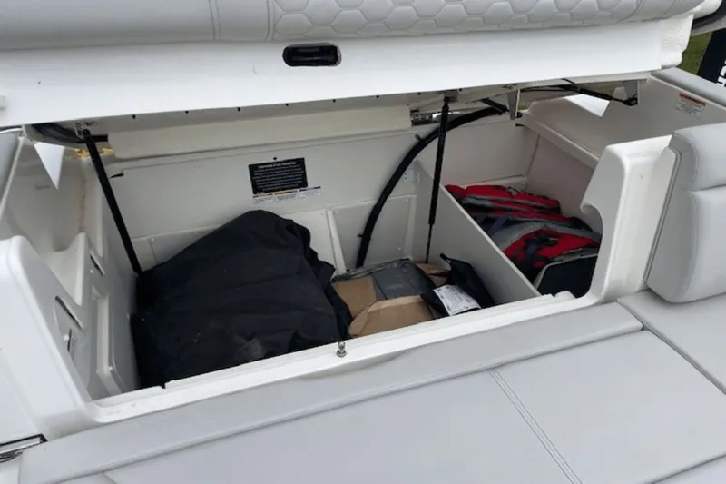  Yacht Photos Pics 2024 Sea Ray SDX 290 Outboard storage compartment with life jackets and gear.