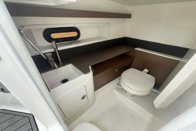  Yacht Photos Pics 2024 Sea Ray SDX 290 Outboard interior with sink and toilet.