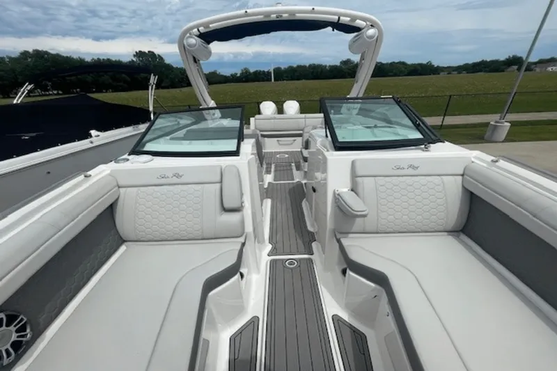  Yacht Photos Pics 2024 Sea Ray SDX 290 Outboard boat interior with luxurious seating and sleek design.