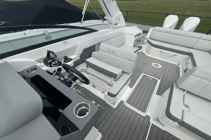  Yacht Photos Pics 2024 Sea Ray SDX 290 Outboard boat interior with sleek seating and modern controls.