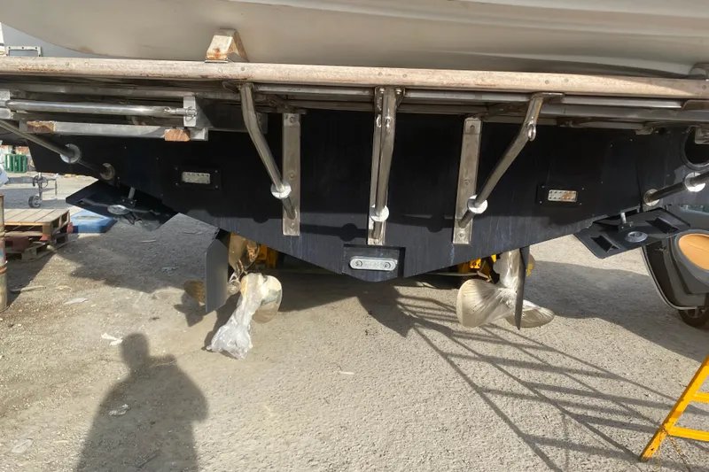  Yacht Photos Pics 1987 Bertram 37 Convertible boat underside with propellers and rudders visible.