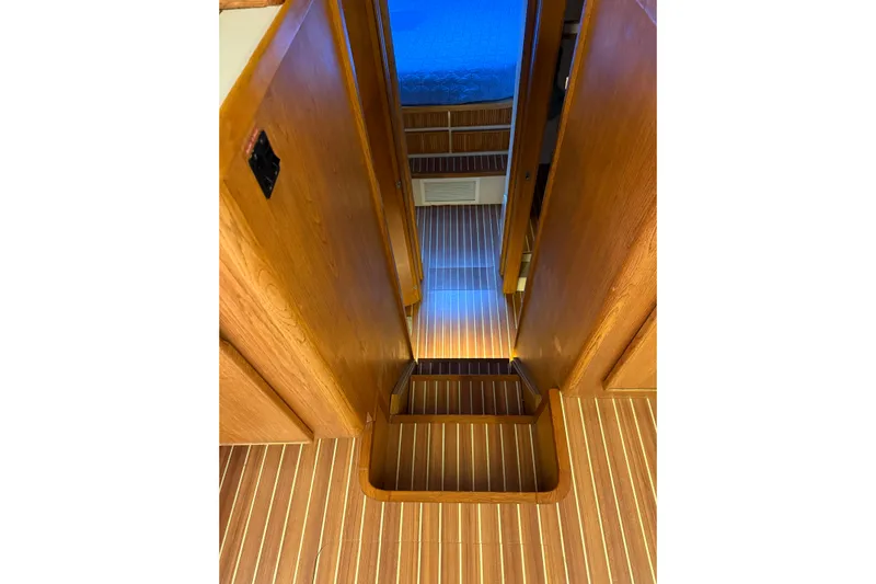  Yacht Photos Pics Interior of 1987 Bertram 37 Convertible yacht with wooden flooring and stairs.