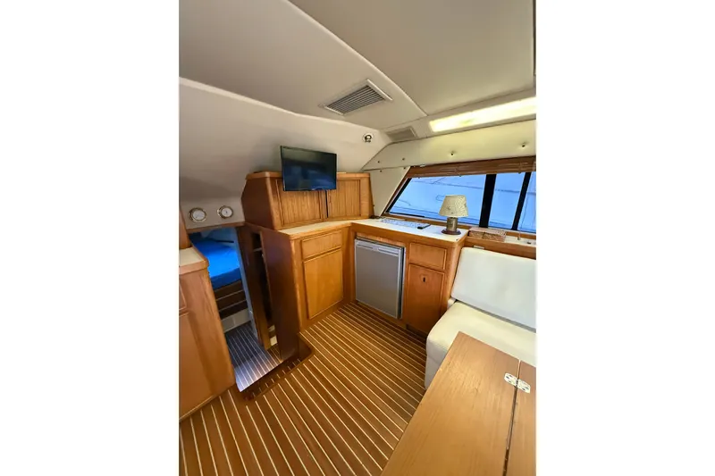  Yacht Photos Pics Interior of 1987 Bertram 37 Convertible yacht with wood paneling and modern amenities.