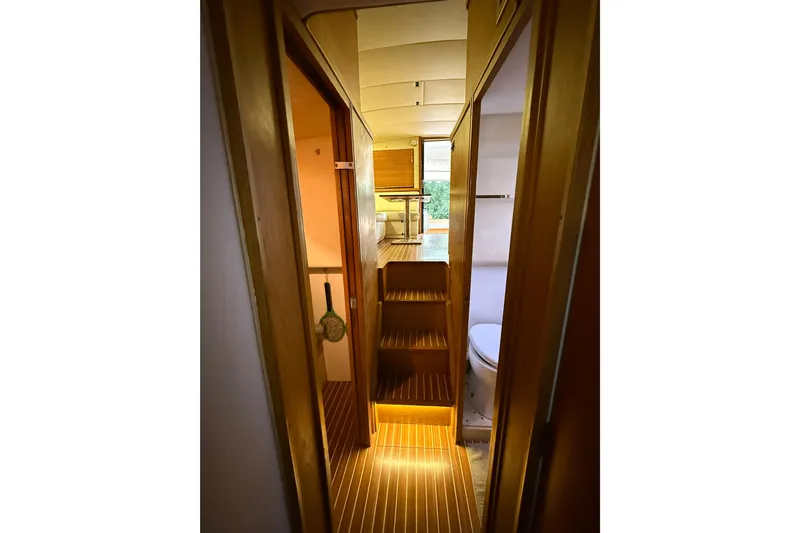  Yacht Photos Pics Interior view of 1987 Bertram 37 Convertible yacht with wooden flooring and compact design.