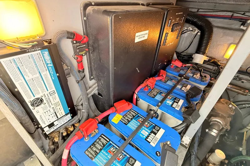 Banking Memories Yacht Photos Pics Engine room of 2001 Sea Ray 410 Express Cruiser with batteries and electrical components.