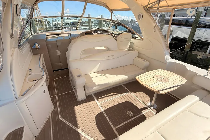 Banking Memories Yacht Photos Pics Luxurious interior of 2001 Sea Ray 410 Express Cruiser with seating and table.