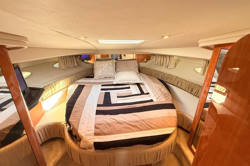 Banking Memories Yacht Photos Pics Luxurious cabin interior of 2001 Sea Ray 410 Express Cruiser with cozy bedding.