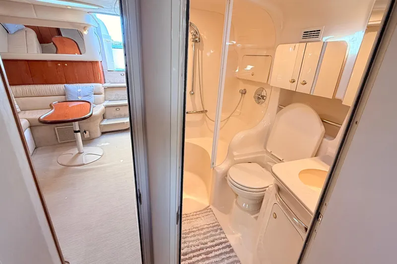Banking Memories Yacht Photos Pics 2001 Sea Ray 410 Express Cruiser interior with bathroom and cozy seating area.