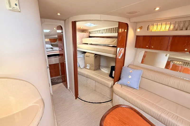 Banking Memories Yacht Photos Pics Interior of 2001 Sea Ray 410 Express Cruiser with cozy seating and bunk beds.