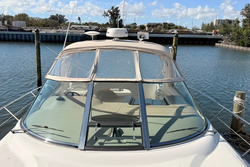 Banking Memories Yacht Photos Pics 2001 Sea Ray 410 Express Cruiser docked at a marina under a clear sky.