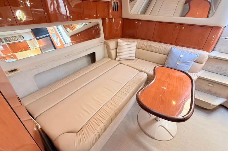 Banking Memories Yacht Photos Pics Luxurious interior of 2001 Sea Ray 410 Express Cruiser with plush seating and elegant wood finishes.