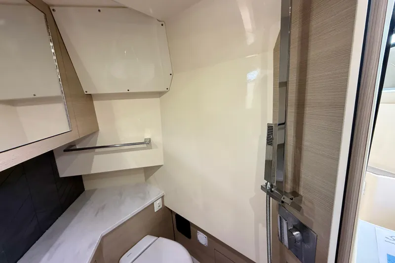  Yacht Photos Pics 2023 Scout 350 LXZ boat bathroom with modern fixtures and sleek design.