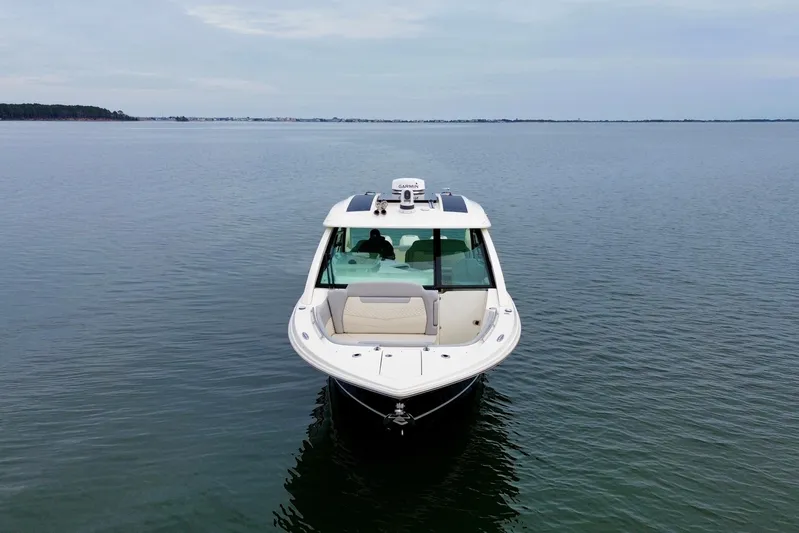  Yacht Photos Pics 2023 Scout 350 LXZ boat on calm water, front view.
