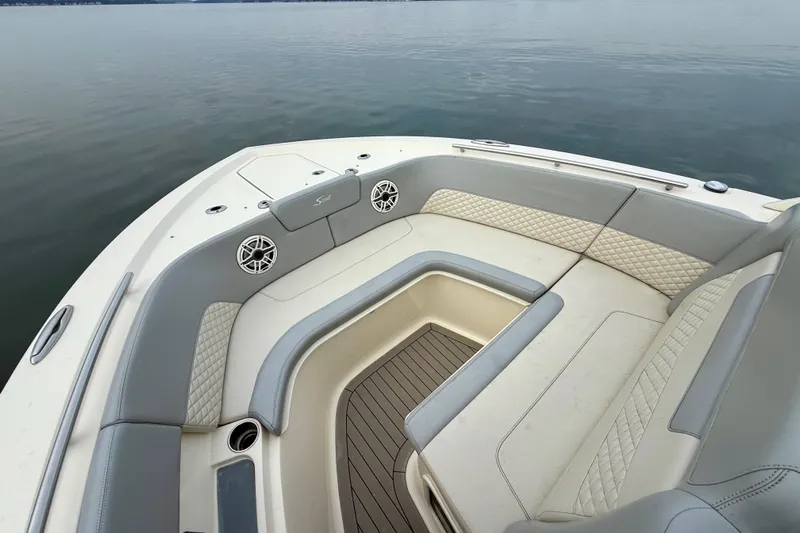  Yacht Photos Pics Luxurious seating area on 2023 Scout 350 LXZ boat, featuring elegant upholstery and spacious design.