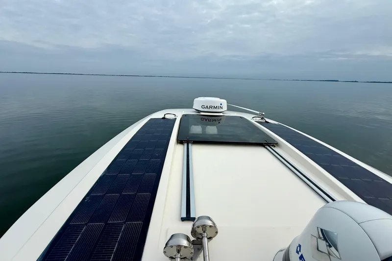  Yacht Photos Pics 2023 Scout 350 LXZ boat with Garmin equipment on calm water.