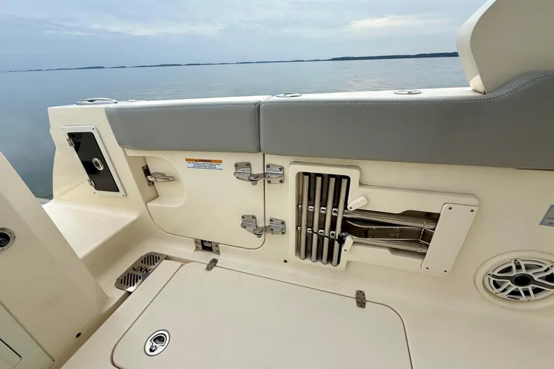  Yacht Photos Pics 2023 Scout 350 LXZ boat interior with storage compartments and seating.