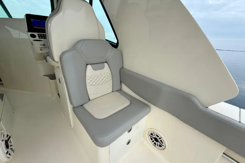  Yacht Photos Pics 2023 Scout 350 LXZ boat interior with gray and white seating.