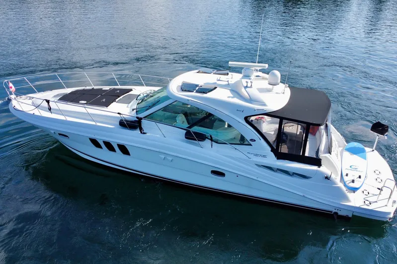  Yacht Photos Pics 2009 Sea Ray 48 Sundancer yacht cruising on calm waters.