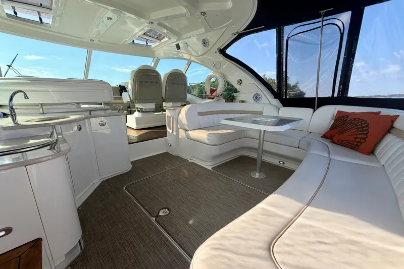  Yacht Photos Pics Luxurious interior of 2009 Sea Ray 48 Sundancer yacht with seating and kitchenette.