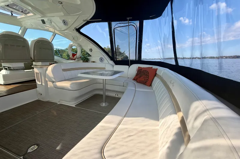  Yacht Photos Pics Luxurious interior of 2009 Sea Ray 48 Sundancer yacht with elegant seating and scenic water view.