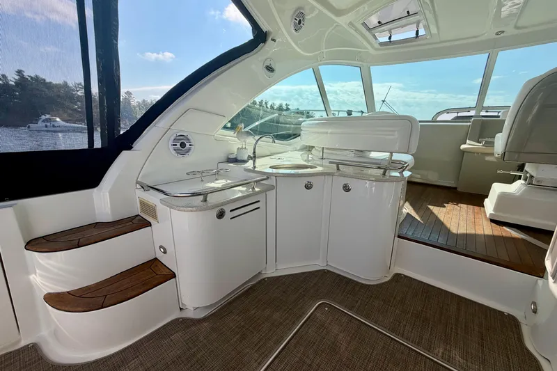  Yacht Photos Pics Luxurious interior of 2009 Sea Ray 48 Sundancer yacht with sleek design and wooden accents.