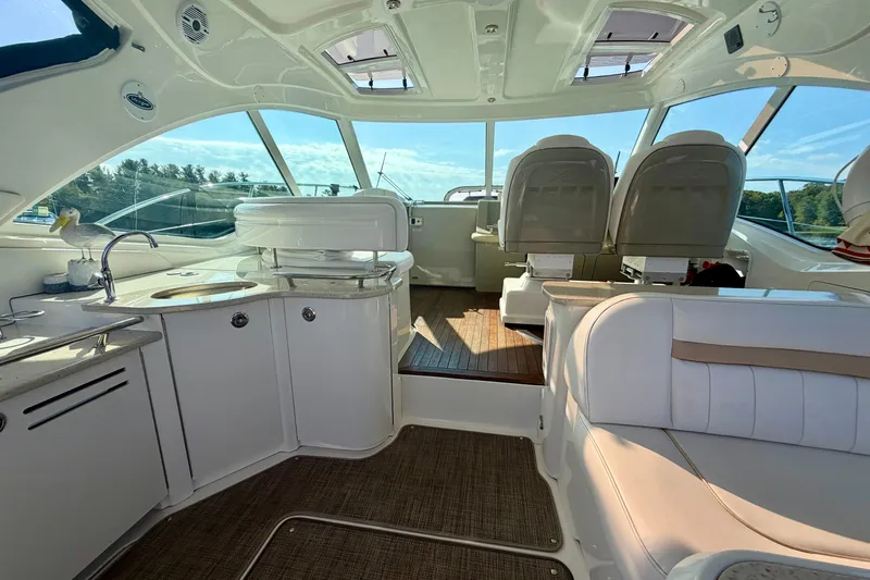  Yacht Photos Pics Luxurious interior of 2009 Sea Ray 48 Sundancer yacht with plush seating and modern amenities.