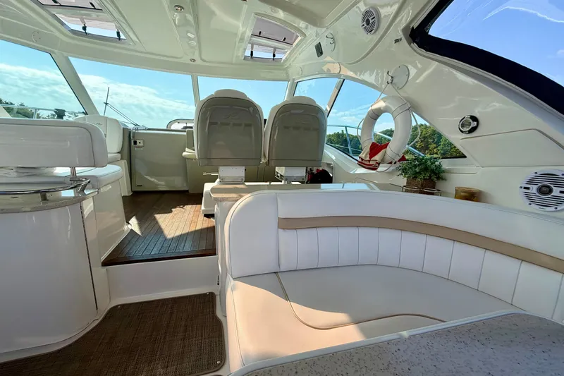  Yacht Photos Pics Luxurious interior of 2009 Sea Ray 48 Sundancer yacht with plush seating and modern design.