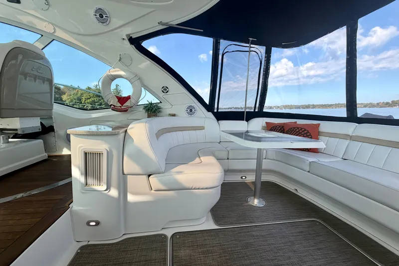  Yacht Photos Pics Luxurious interior of 2009 Sea Ray 48 Sundancer yacht with elegant seating and scenic views.