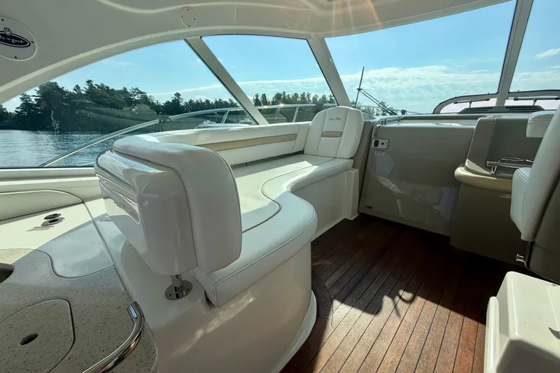  Yacht Photos Pics Luxurious interior of 2009 Sea Ray 48 Sundancer yacht with elegant seating and wood flooring.
