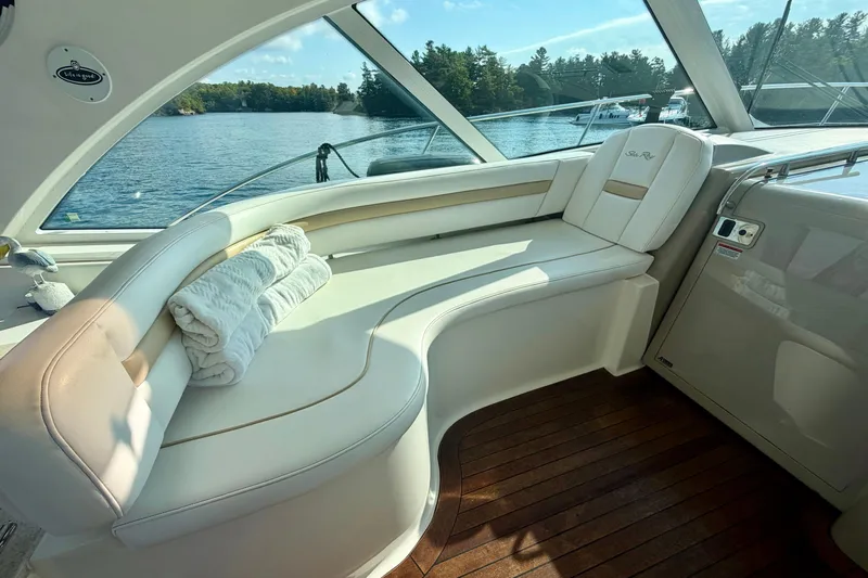  Yacht Photos Pics Luxurious interior of 2009 Sea Ray 48 Sundancer yacht with plush seating and scenic water view.
