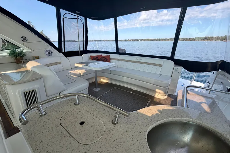  Yacht Photos Pics Luxurious 2009 Sea Ray 48 Sundancer yacht interior with elegant seating and scenic water view.