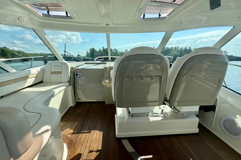  Yacht Photos Pics 2009 Sea Ray 48 Sundancer yacht interior with plush seating and panoramic windows.