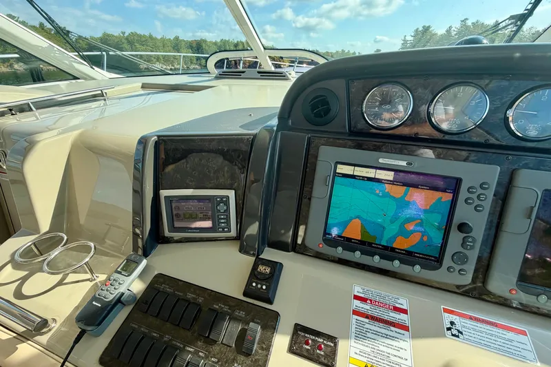  Yacht Photos Pics Dashboard of a 2009 Sea Ray 48 Sundancer with navigation and control instruments.