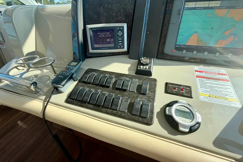  Yacht Photos Pics Control panel of a 2009 Sea Ray 48 Sundancer yacht with navigation and communication equipment.