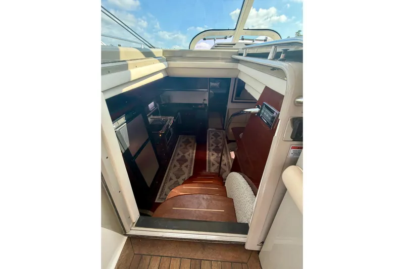  Yacht Photos Pics Interior view of 2009 Sea Ray 48 Sundancer yacht, featuring elegant wooden stairs and modern design.