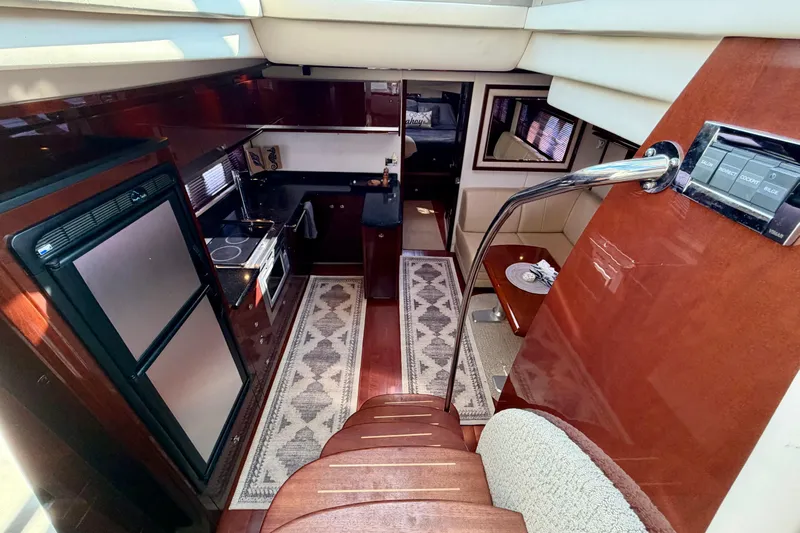  Yacht Photos Pics Luxurious interior of 2009 Sea Ray 48 Sundancer yacht with modern kitchen and dining area.