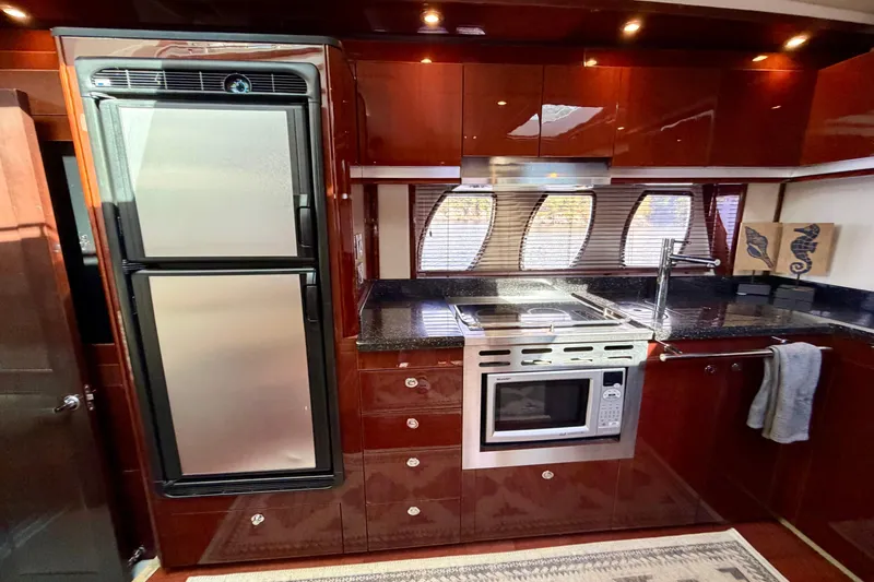  Yacht Photos Pics Luxurious kitchen interior of 2009 Sea Ray 48 Sundancer yacht with modern appliances.