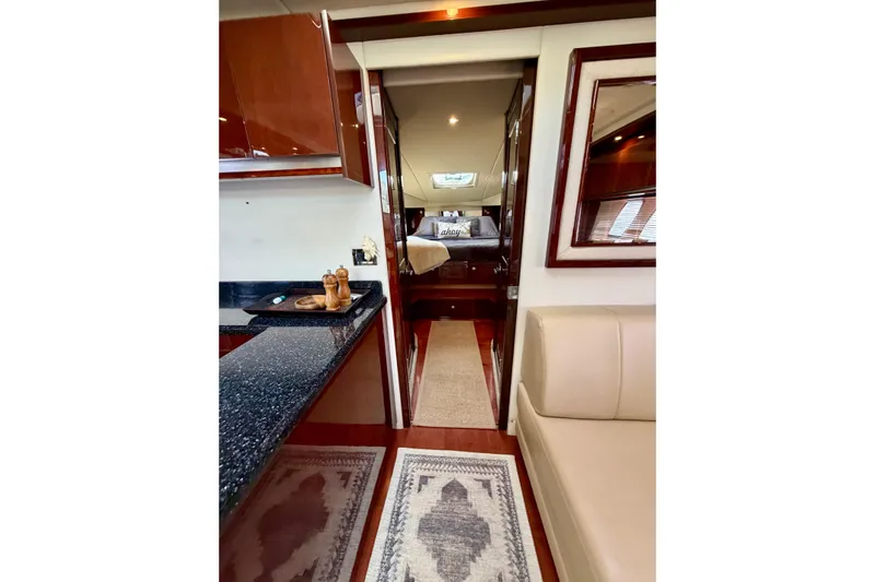  Yacht Photos Pics Luxurious interior of 2009 Sea Ray 48 Sundancer yacht with elegant furnishings.