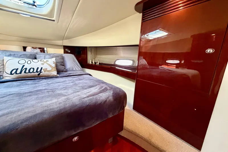  Yacht Photos Pics Luxurious cabin interior of 2009 Sea Ray 48 Sundancer yacht with plush bedding.