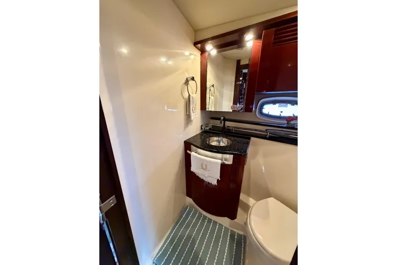  Yacht Photos Pics Luxurious bathroom in 2009 Sea Ray 48 Sundancer yacht with elegant fixtures and modern design.