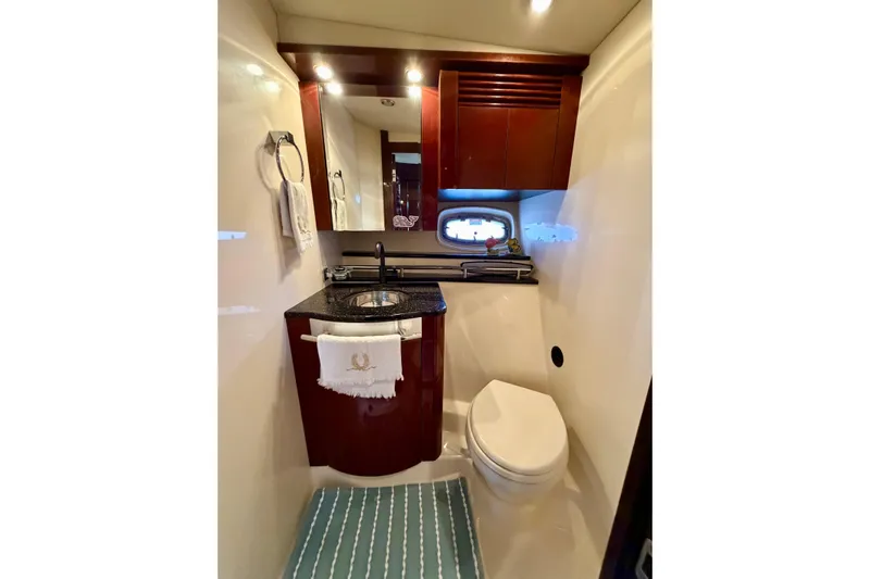  Yacht Photos Pics Luxurious bathroom in 2009 Sea Ray 48 Sundancer yacht with elegant wood cabinetry.